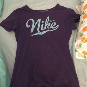 purple and turquoise nike shirt